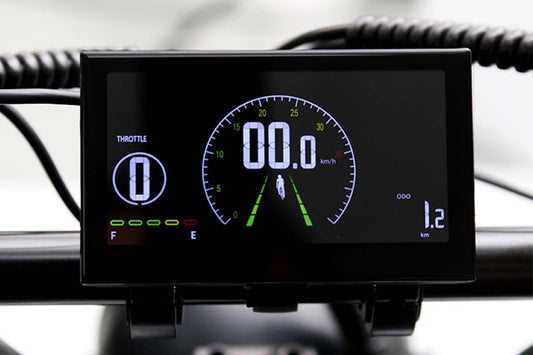 Emoko electric bike LCD display showing speed throttle and distance on a black screen